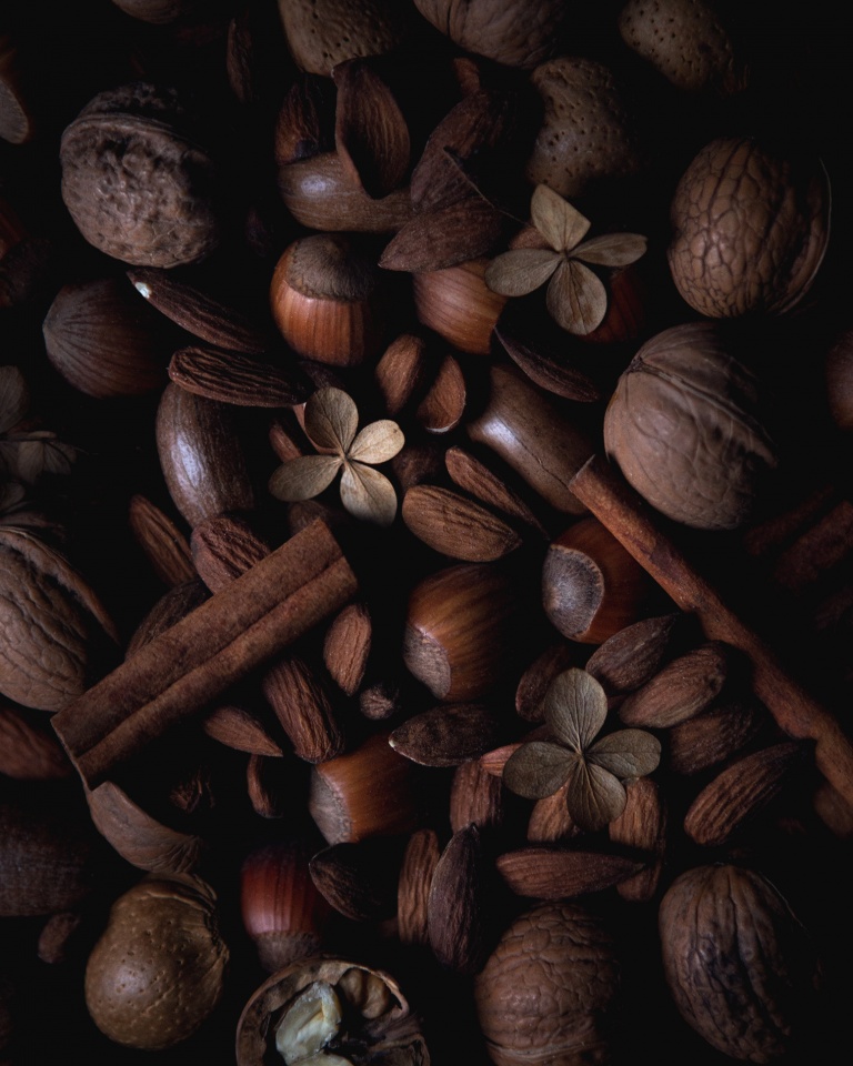 Texture shot of nuts and cinnamon